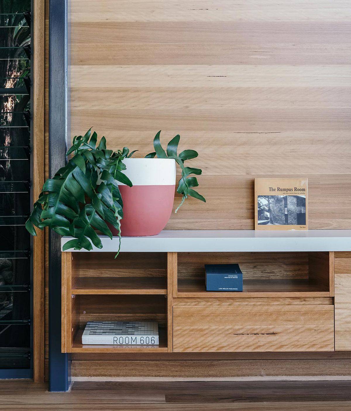 Custom wooden cabinetry throughout the Hidden Studio helps tuck away mess