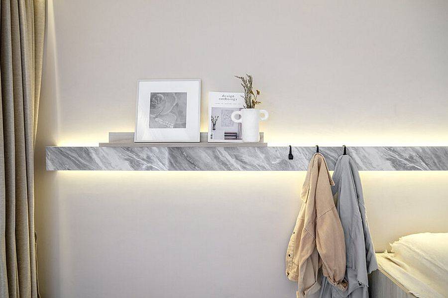 Decorating-the-slim-floating-shelf-in-stone-that-offers-additional-storage-space-15389