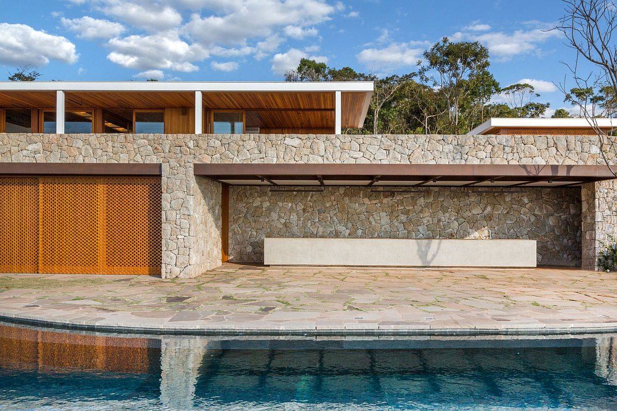 Natural stone along with wood has been used to create this gorgeous contemporary home