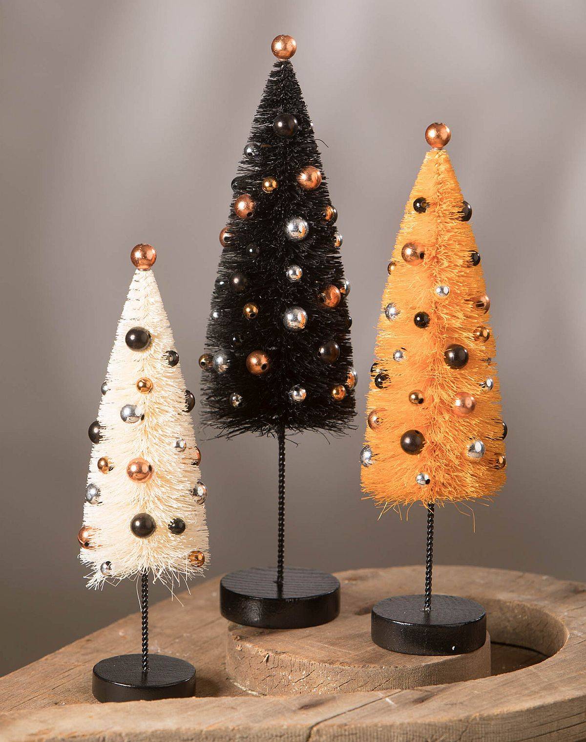 Small Halloween trees crafted from bottle brushes are great for the minimal Halloween table