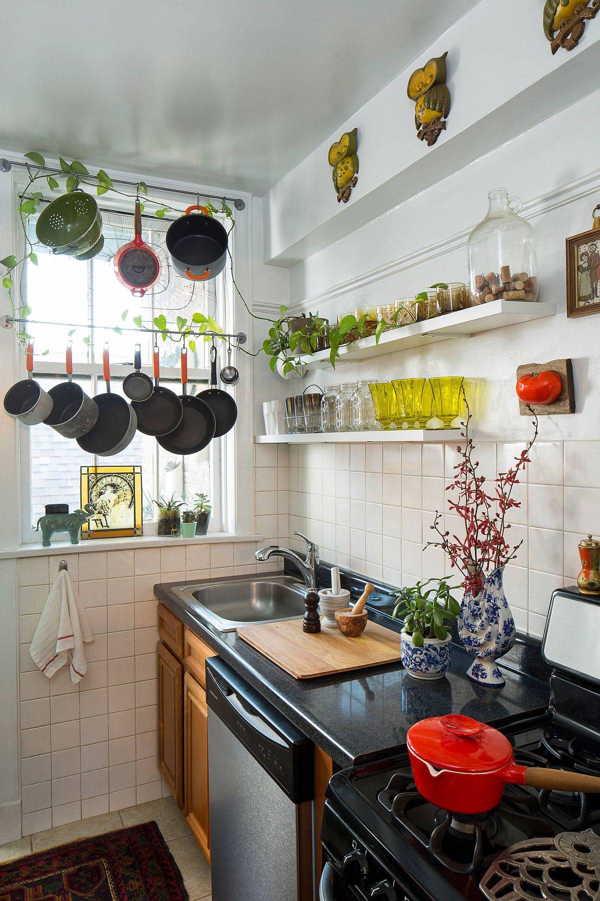 Small and eclectic single wall kitchen with space to hang the pots and pans
