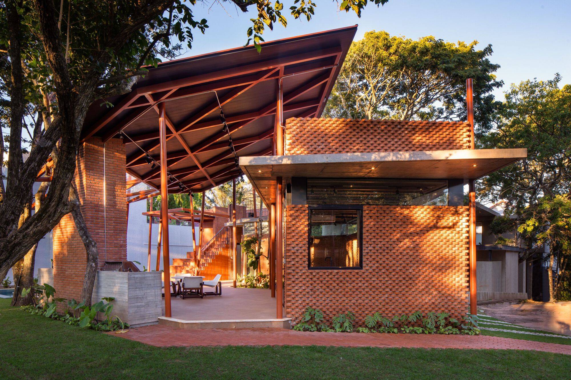 Traditional building materials are combined with modern farm for this backyard retreat created using clay bricks