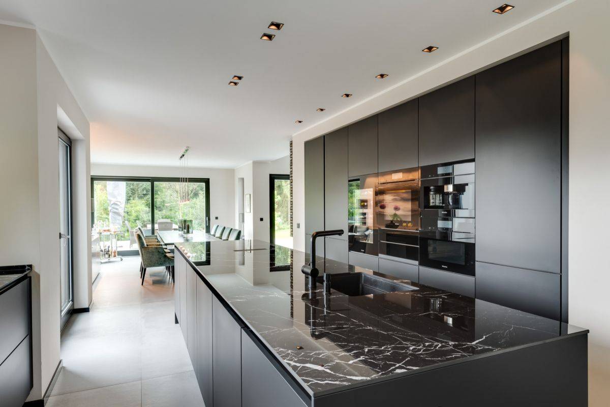 Black-cabinets-and-appliances-are-coupled-with-black-quartz-countertops-that-steal-the-spotlight-38070