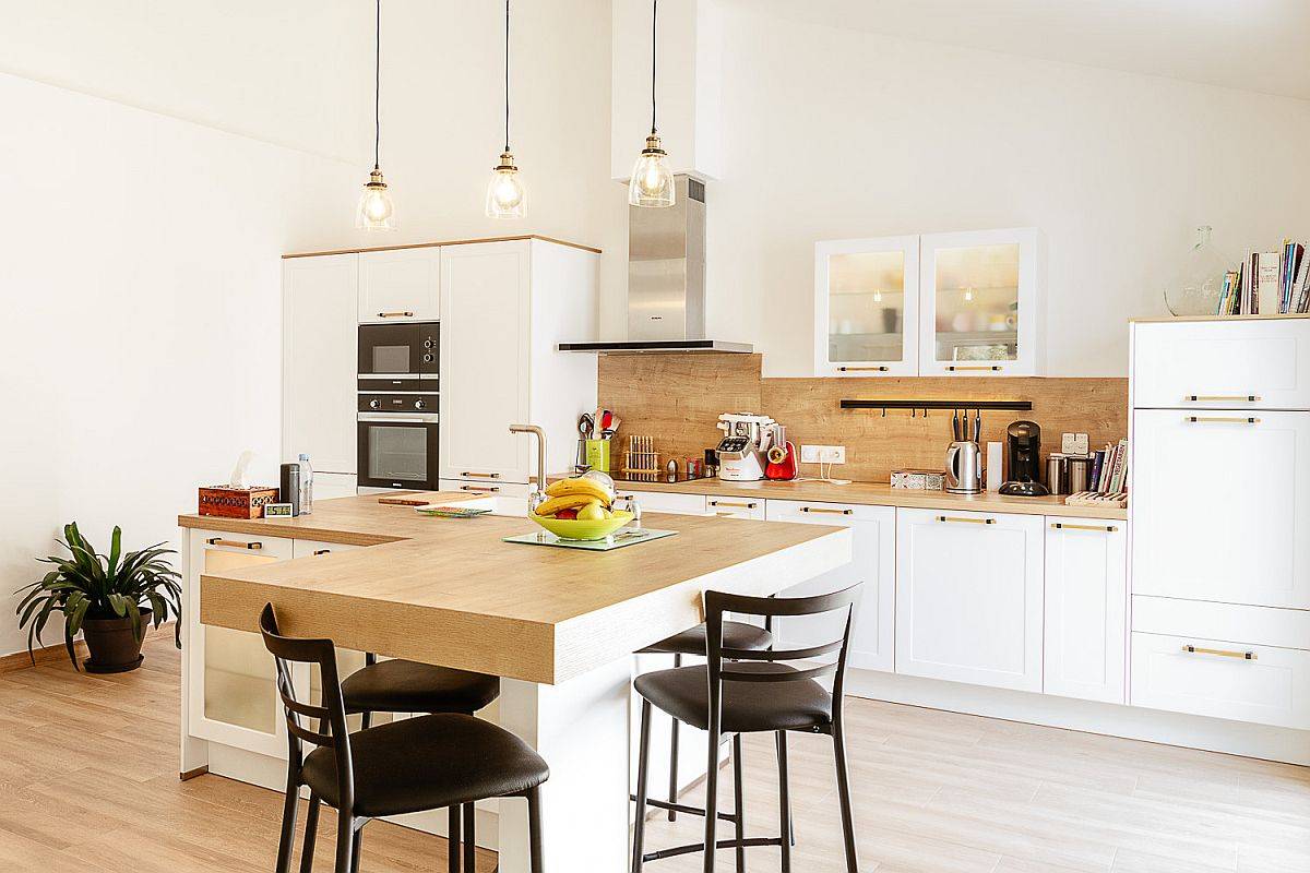 Creative kitchen island with wooden countertops steals the spotlight in here
