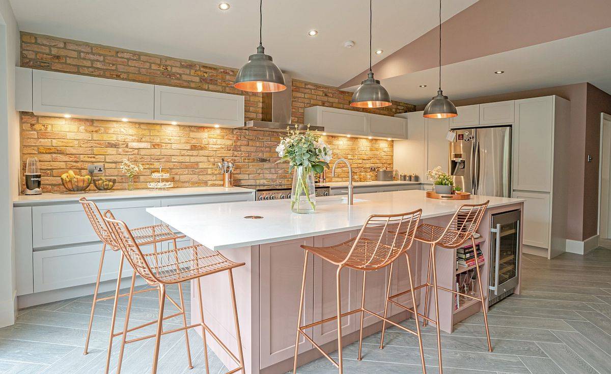 Dashing kitchen with brick wall backsplash and engineered quartz countertops
