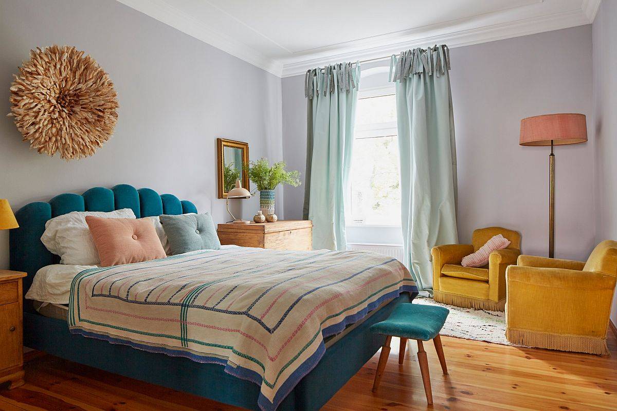 Different shades of blue and yellow light up this small eclectic bedroom