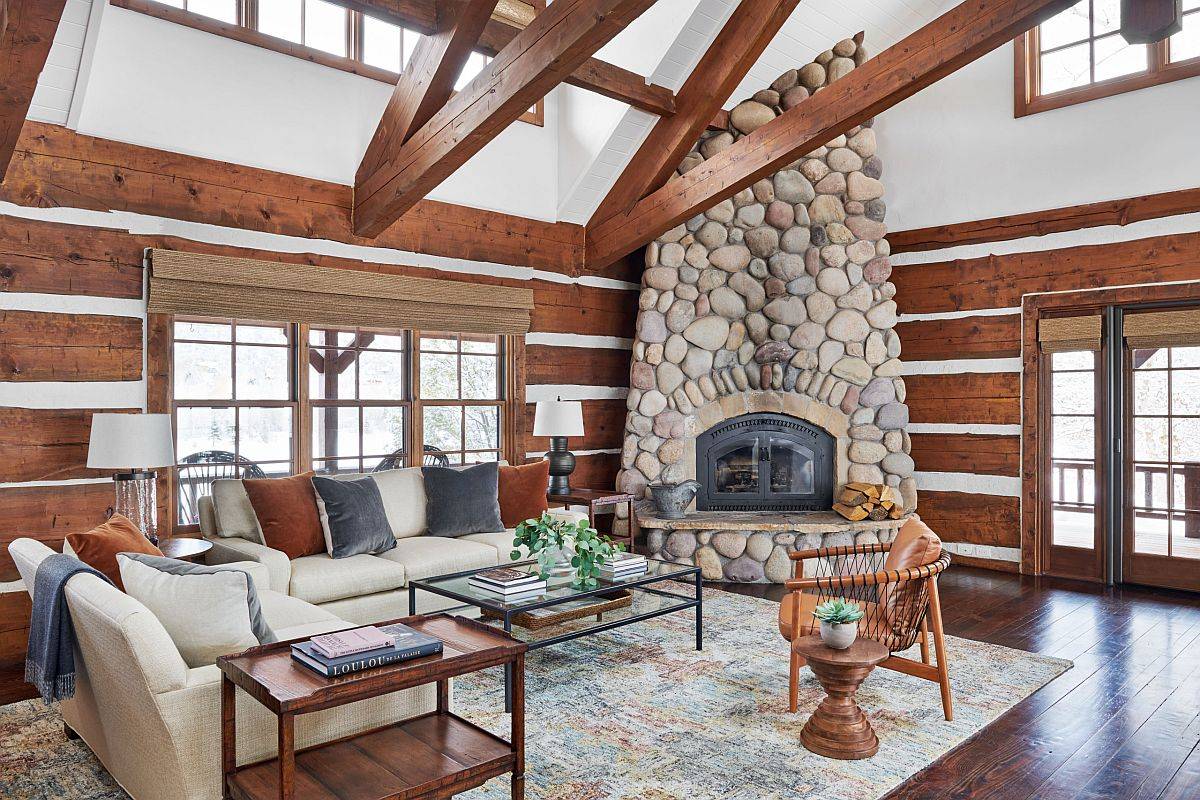 Eye-catching-stone-fireplace-in-the-corner-makes-the-biggest-impact-in-this-double-height-transitional-living-room-50670
