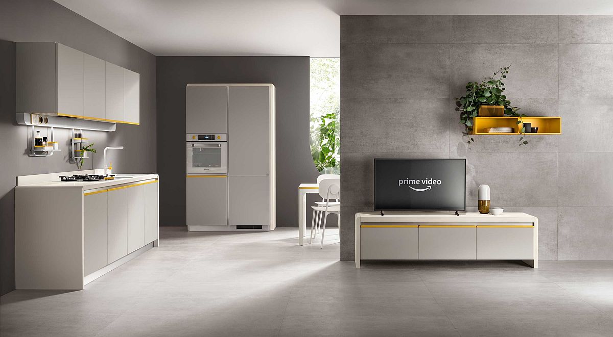 Gray and white kitchen with a touch of yellow seamlessly integrates with the living room