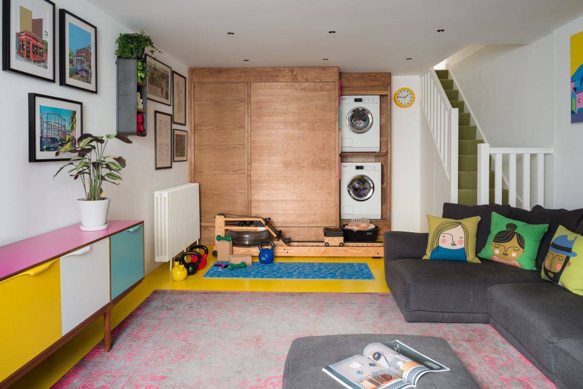 Laundry room, playroom and relaxation zone are part of this multi-tasking family room