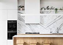 Lovely-white-marble-backsplash-steals-the-show-in-this-kitchen-with-wooden-cabinets-and-island-79921-217x155