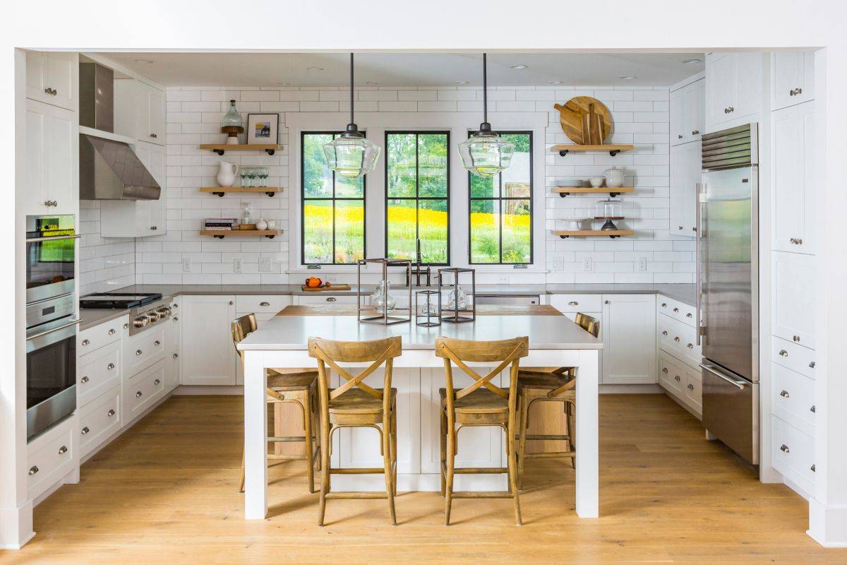 Modern farmhouse style kitchen with quartz countertops along with white tiled backsplash
