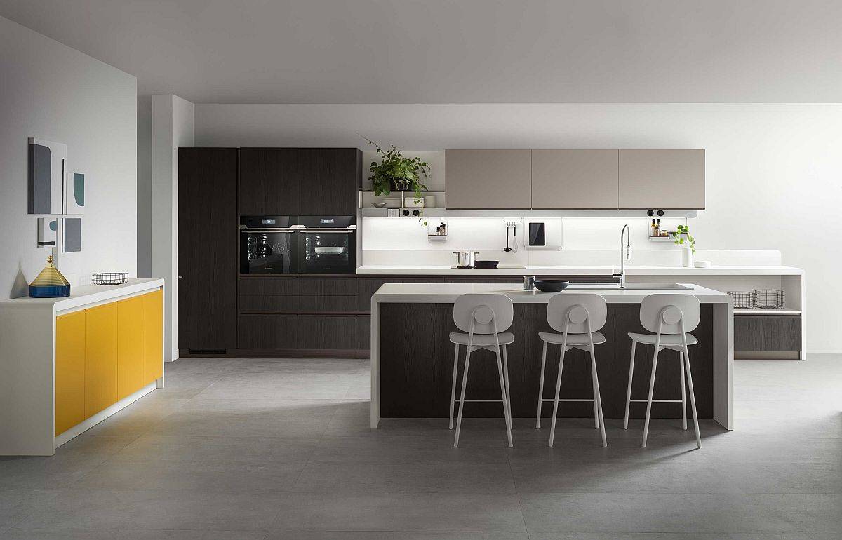 Pop of yellow of the custom credenza in the corner enlivens the neutral contemporary kitchen