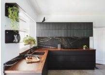 Stone-black-backsplash-combined-with-wooden-countertops-in-the-polished-contemporary-kitchen-79154-217x155