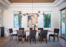 Wall-art-piece-in-this-dining-room-is-placed-smartly-between-the-two-windows-to-create-visual-symmetry-83243-217x155