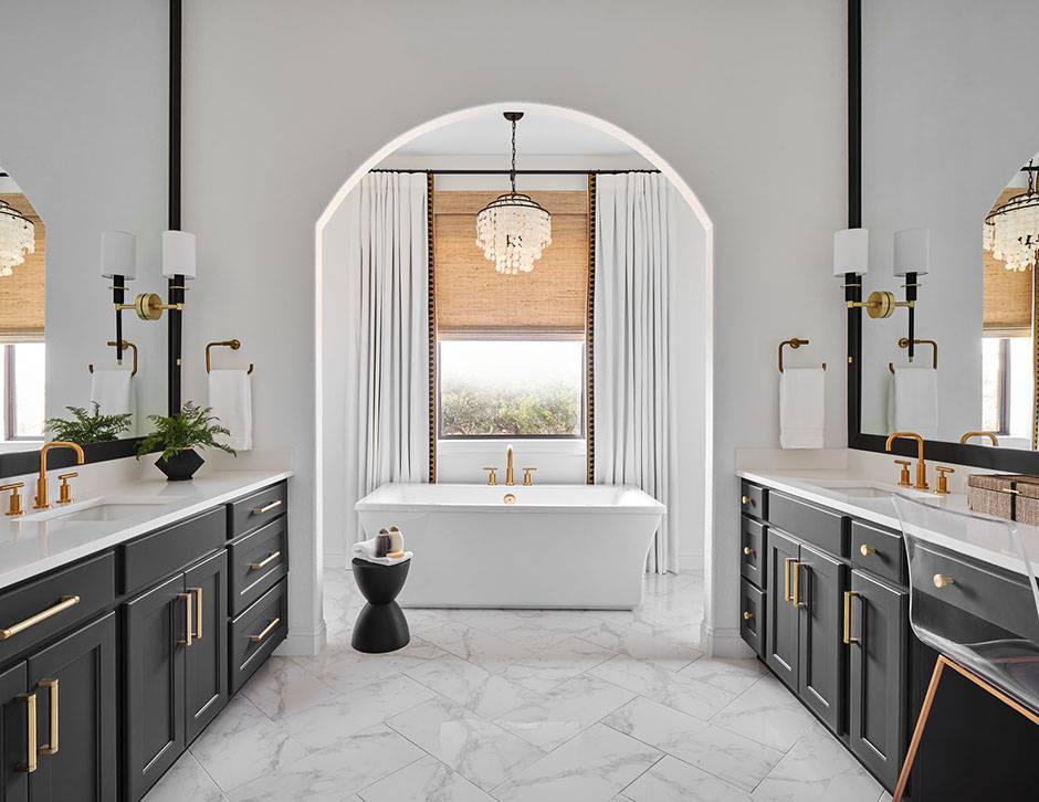 beige roman shades in large marble bathroom