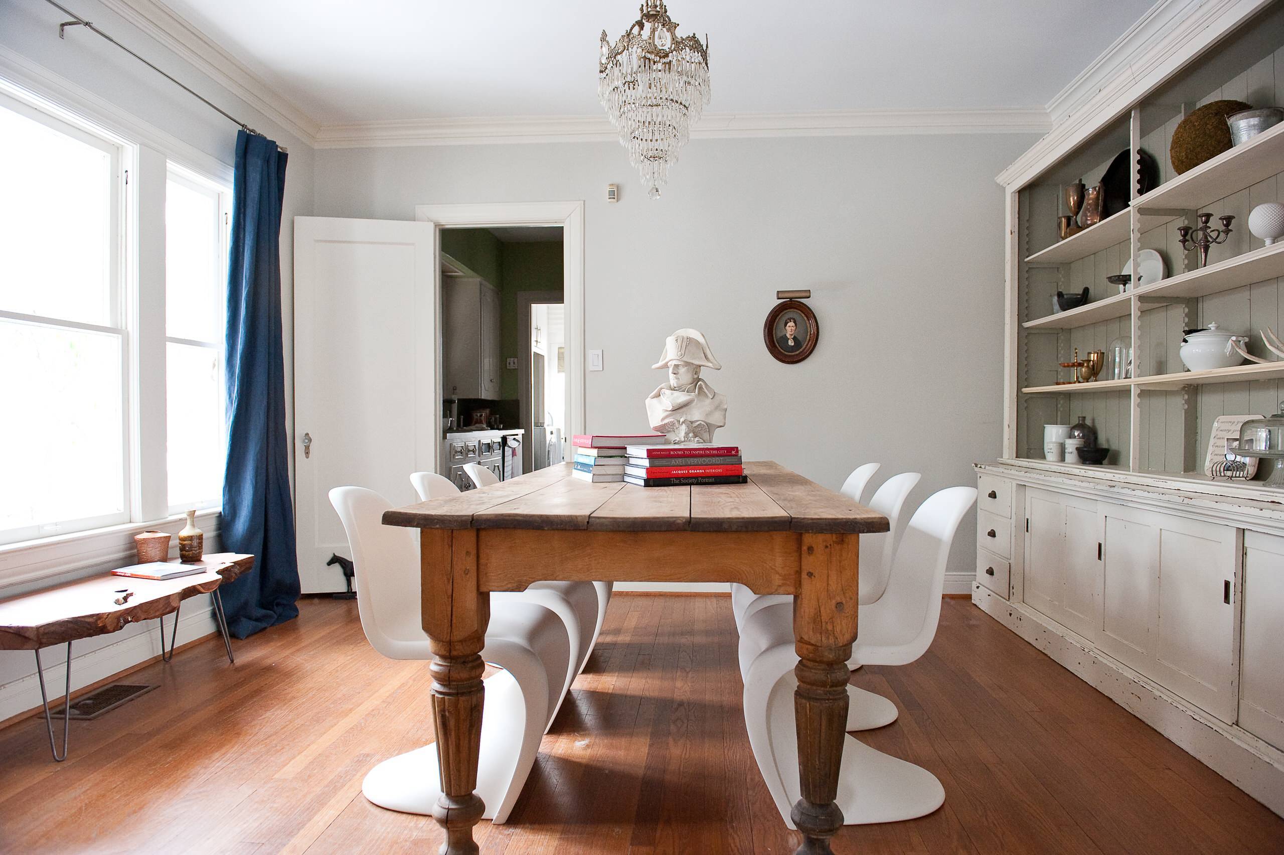 Impressive antique dining table complemented with futuristic chair design ( from Houzz)