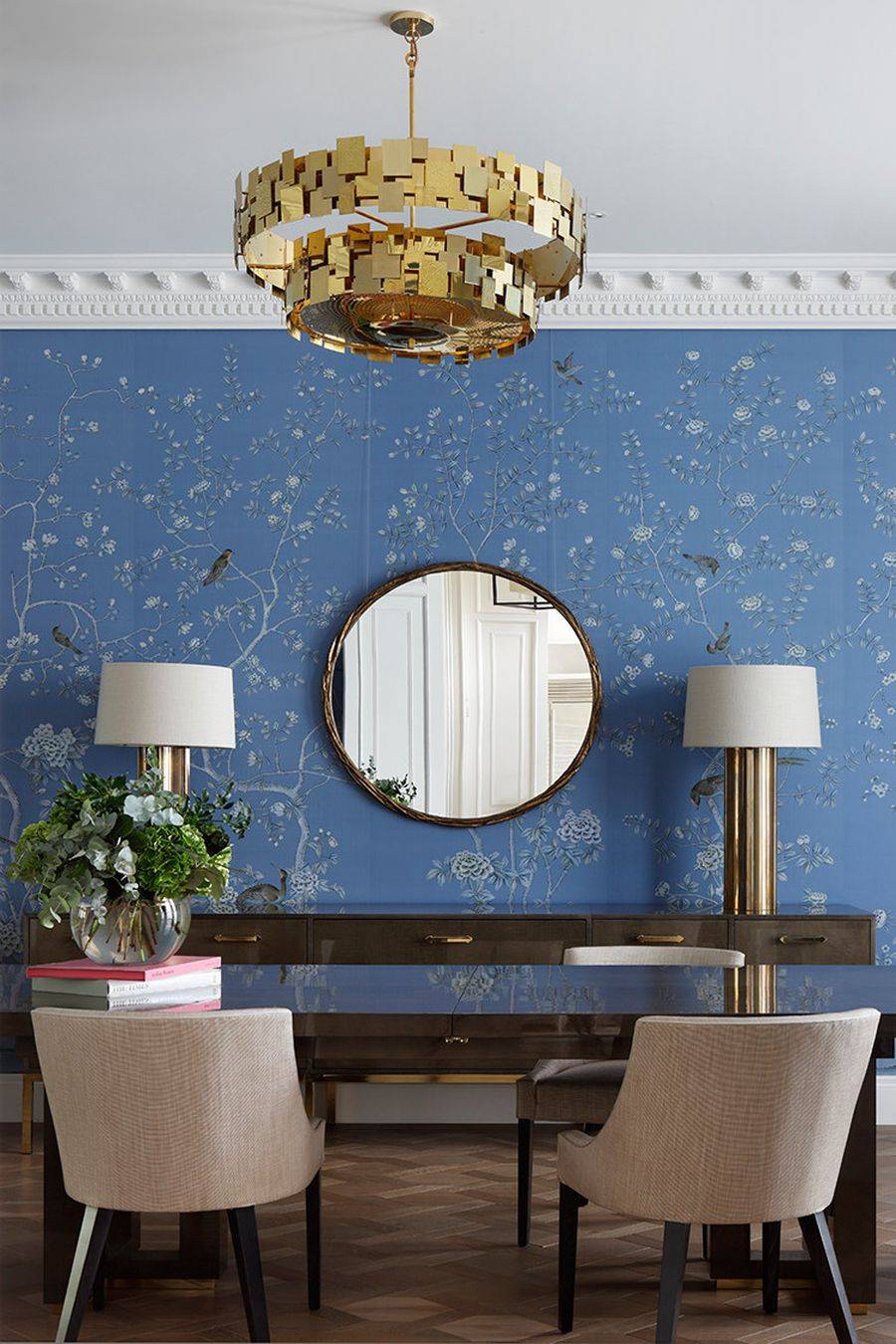 Blue wallpaper with pattern brings cheerful charm to this dining space