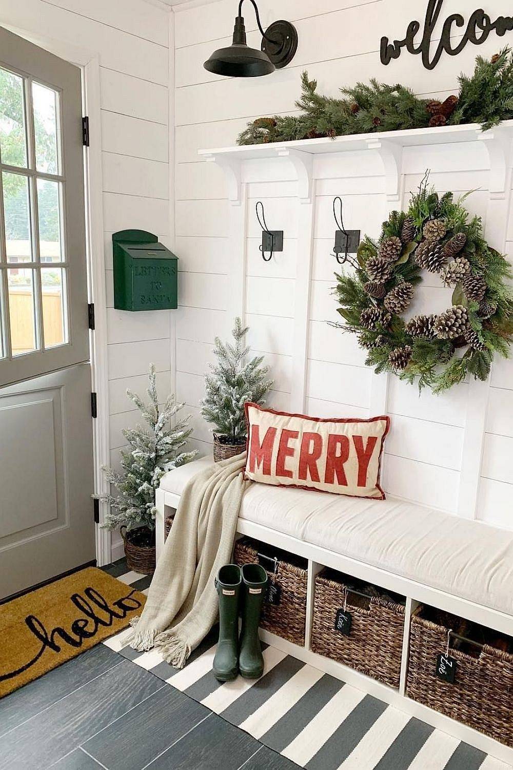 Modern Farmhouse style entry with Christmas decorations in white and wood