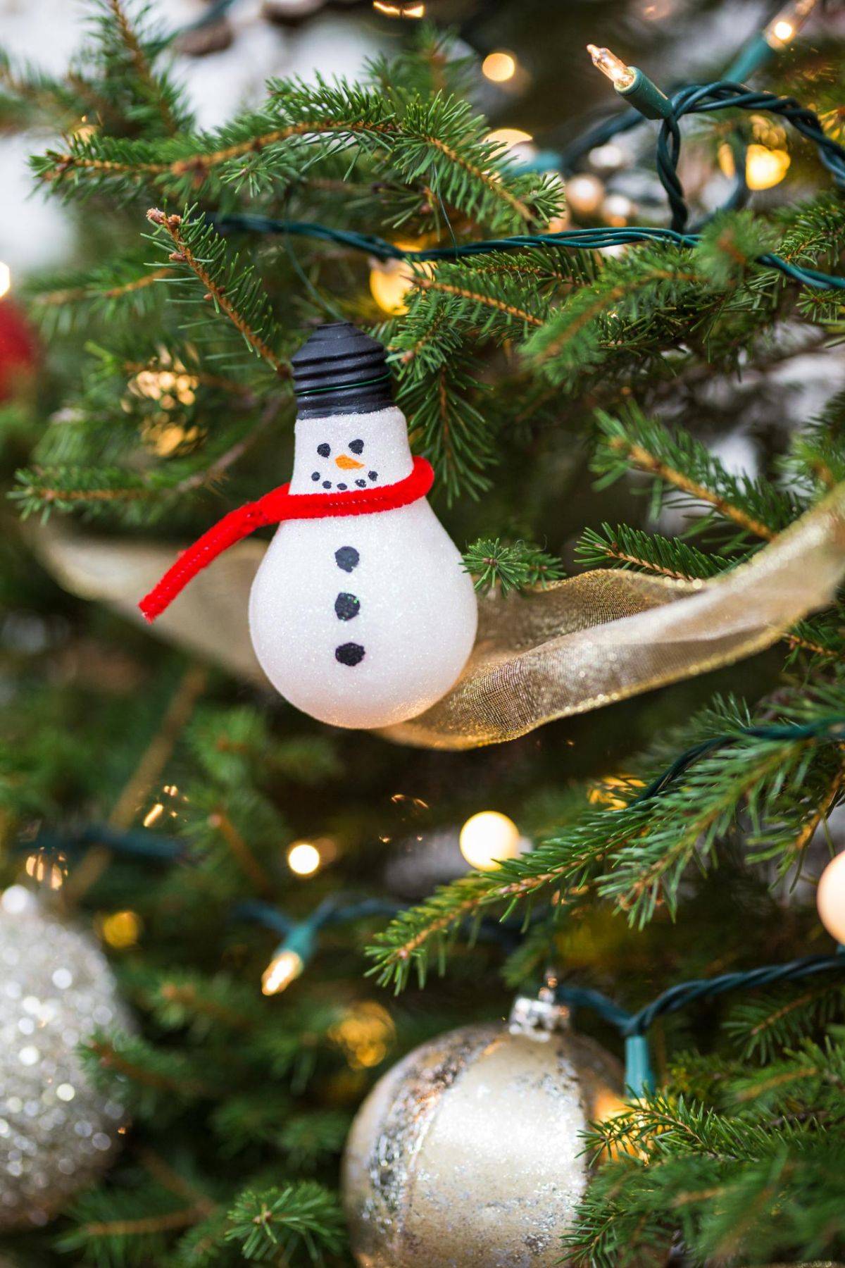 Snowman Christmas tree ornament crafted using a light bulb