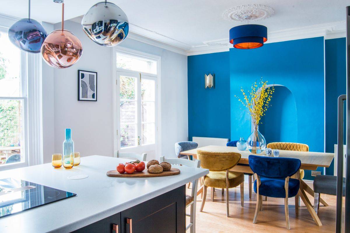 Stunning blue accent wall steals the spotlight in here