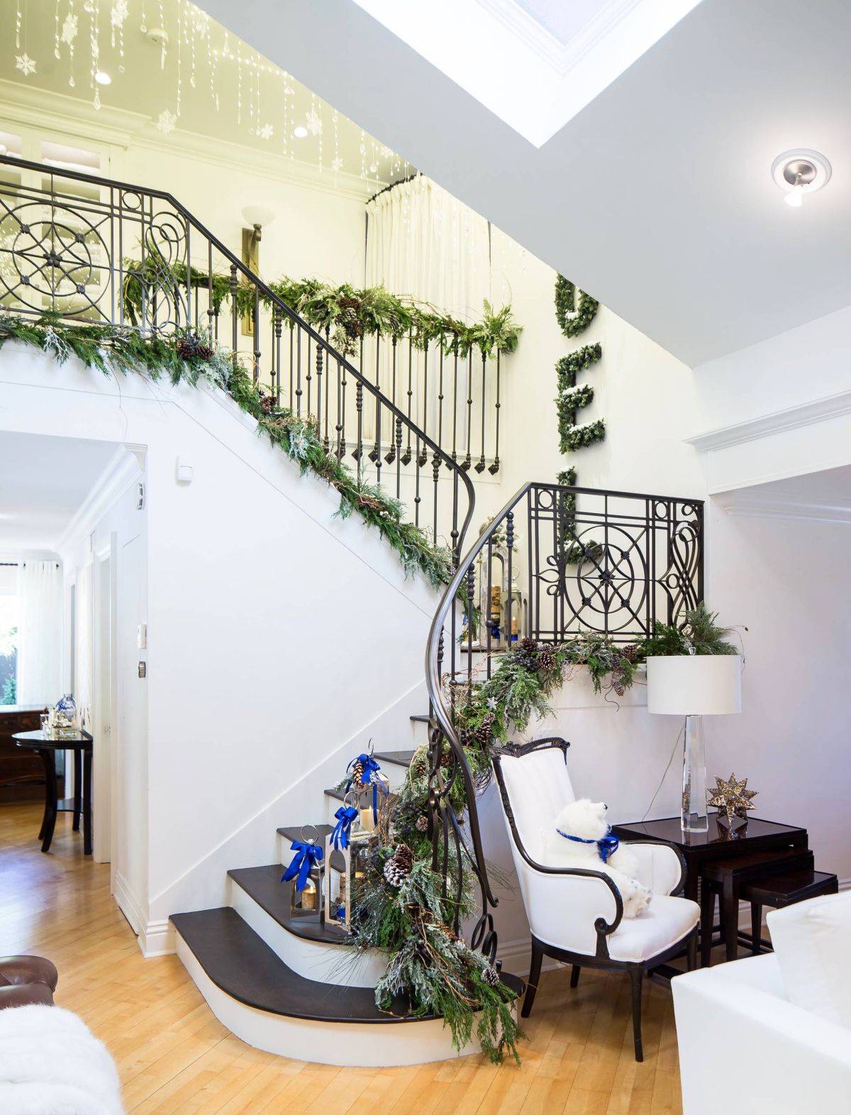 Touch of green is the perfect way to add festive cheer to this entry with staircase