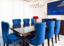 Wall-art-in-deep-blue-perfectly-complements-the-colorful-chairs-in-this-white-dining-room-73056-217x155