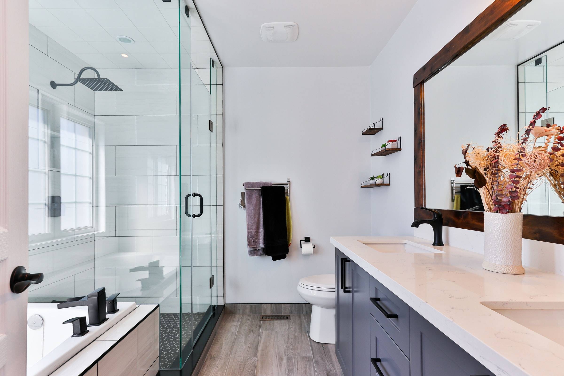 Jack and Jill bathroom with sleek glass shower (from Unsplash)