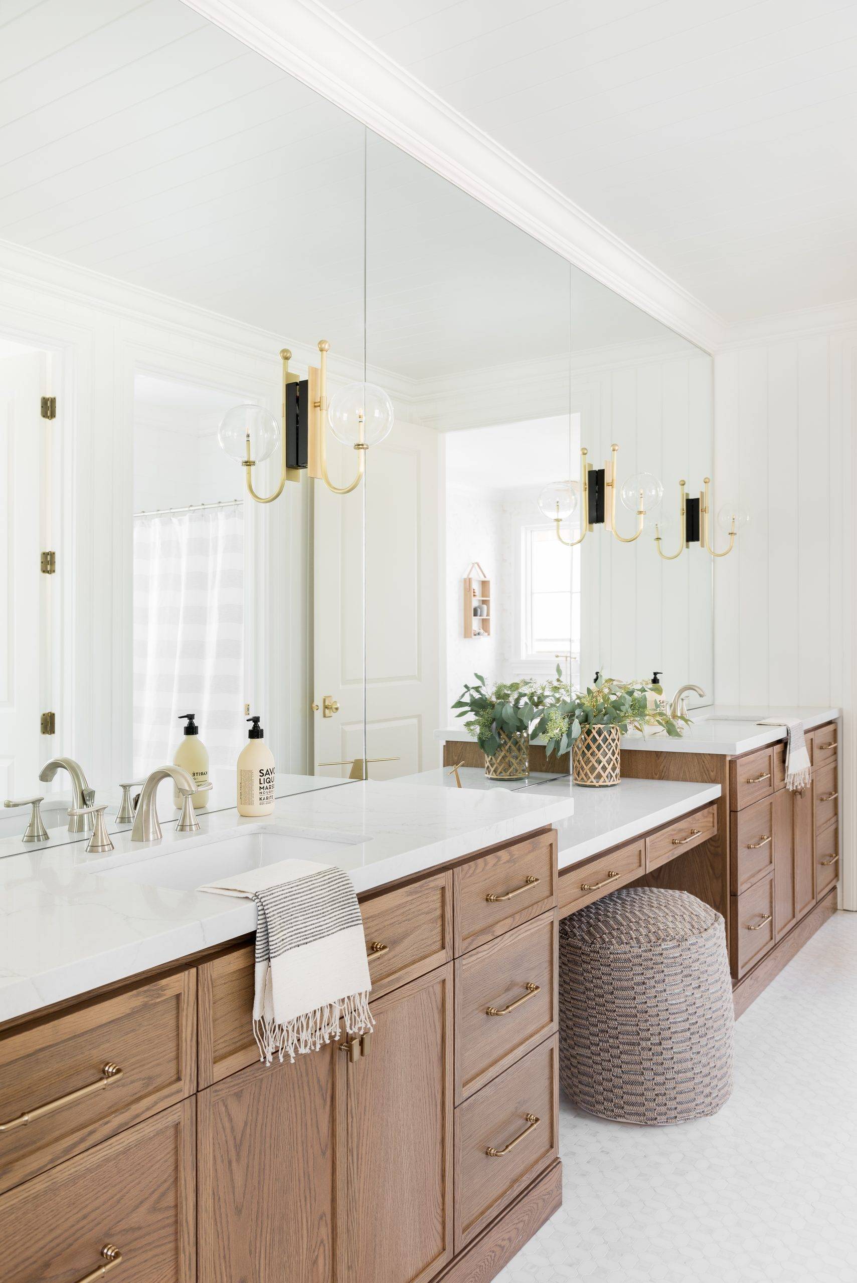 Warm Jack and Jill bathroom with spacious vanity (from Studio McGee)