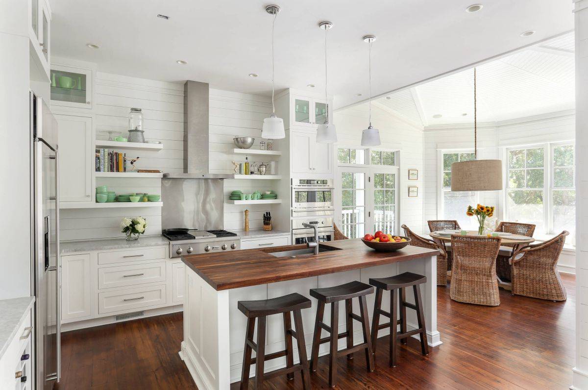 Beach-style-kitchen-with-wood-and-white-color-scheme-that-is-connected-to-the-dining-space-83991