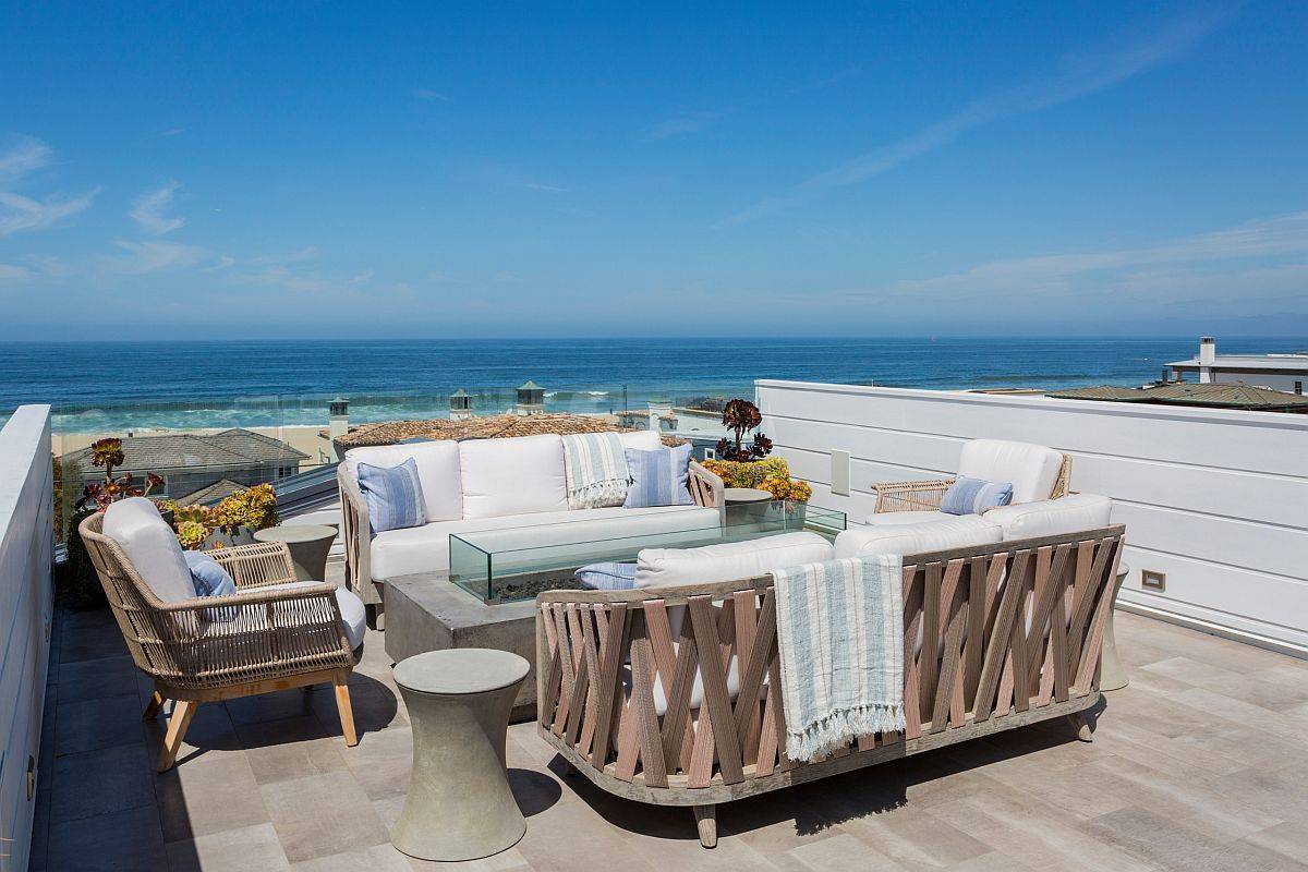 Beautiful beach style deck with ocean views, sitting area around a fire pit