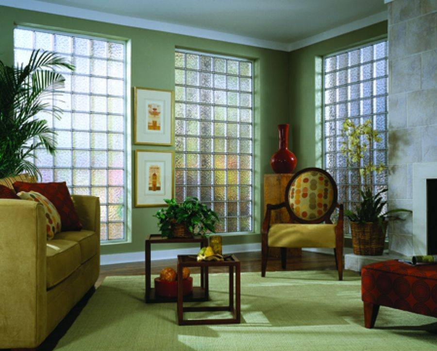 Beautiful living room in green with tinted glass block windows