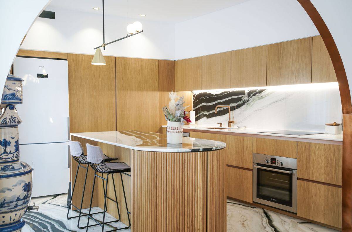 Beautiful marble floor and backsplash steals the spotlight in here