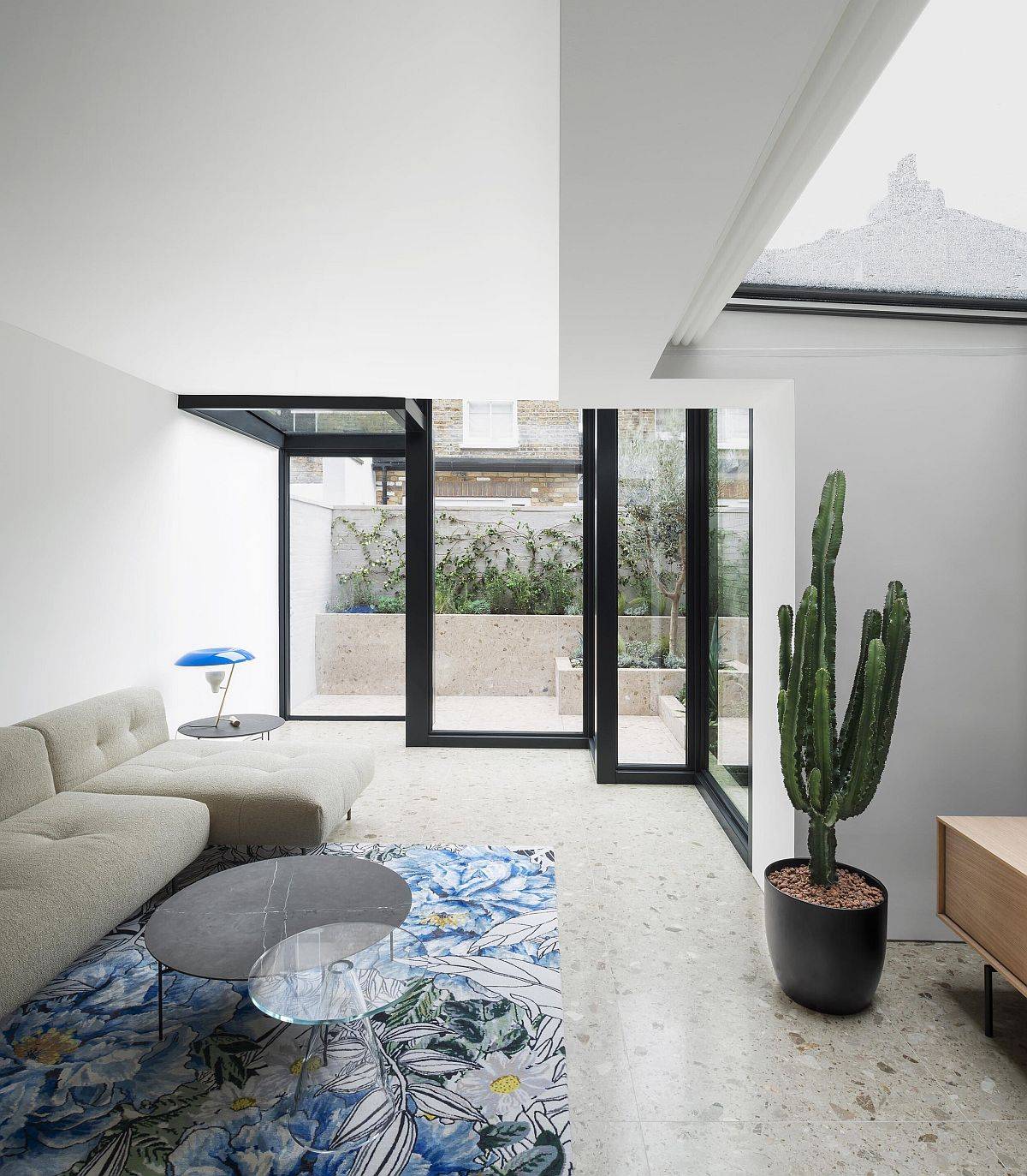 Box-style glass enclosures coupled with a captivating skylight bring light inside the house