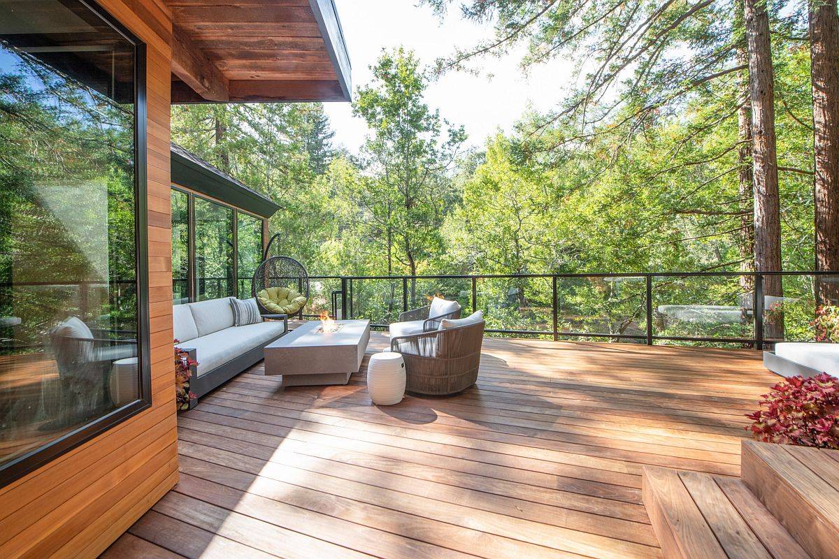 Contemporary deck of San francisco home with gorgeous green nature views and a smart sitting area