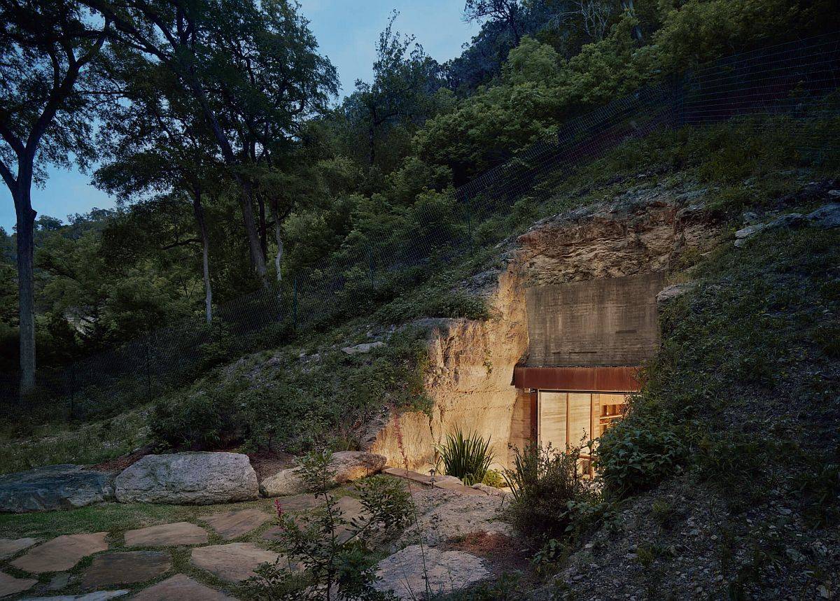 Curated placement of boulders, a few steps and a wall of green create the entry for this awesome wine cave