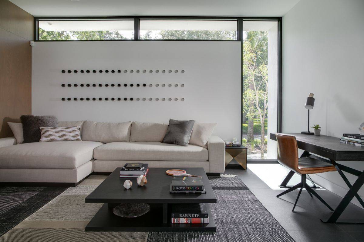 Custom and clerestory windows usher natural light into the spacious home office