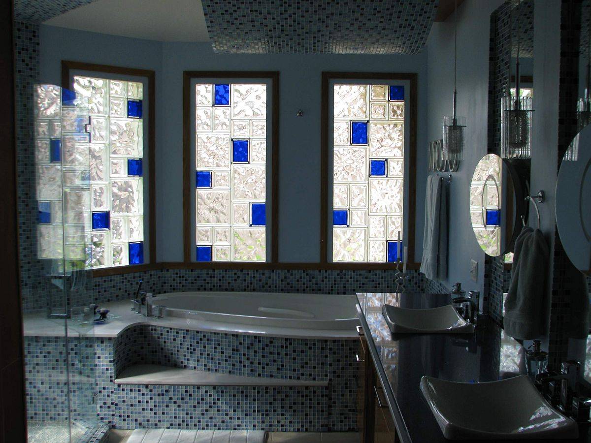 Custom glass block windows of New Orleans home also add a pop of bold blue to the setting