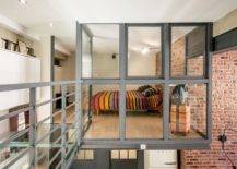 Eclectic-loft-style-bedroom-of-Paris-home-with-glass-walls-and-cantilevered-design-72873-217x155