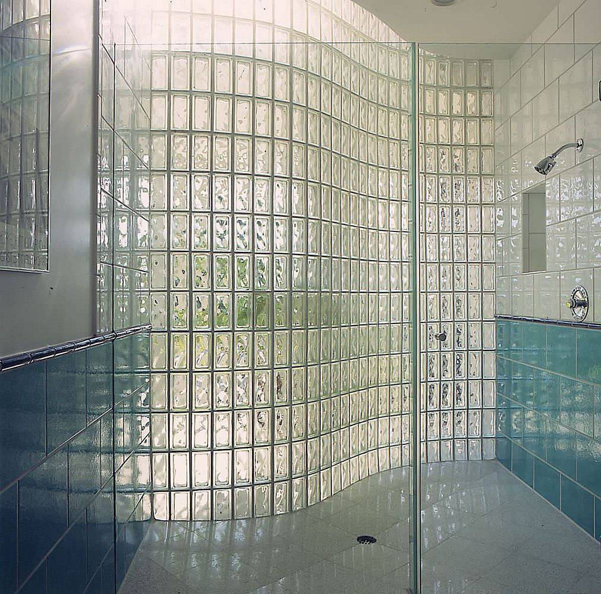 Fabulous curved glass block wall for th shower area of the blue and white modern bathroom