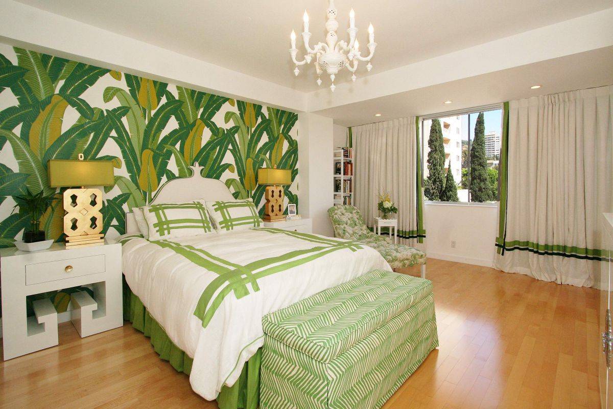 A lush patterned headboard wall lends tropical charm to this contemporary bedroom-59377