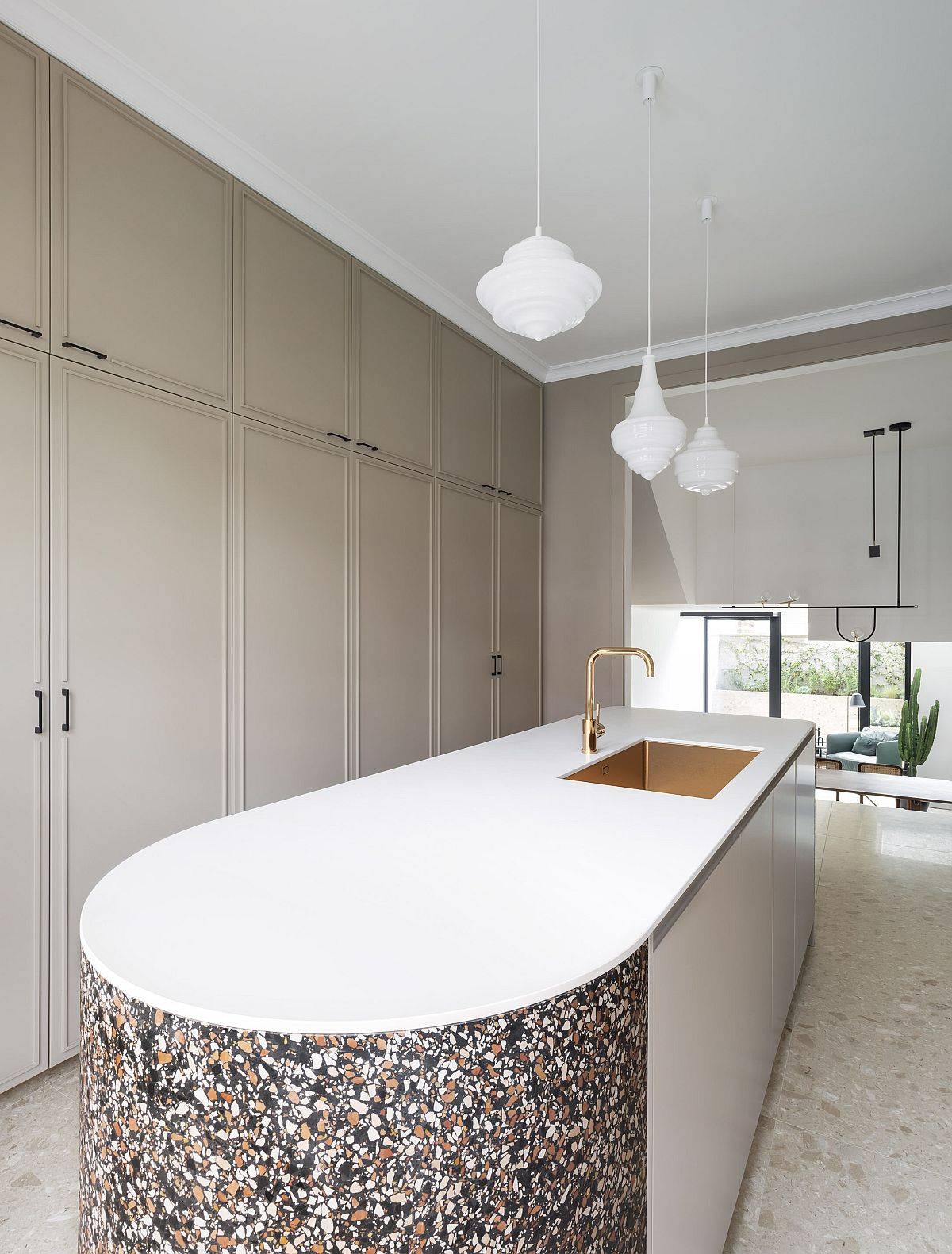 Kitchen-island-with-a-rounded-edge-and-terrazo-tile-finish-makes-a-big-visual-impact-36739
