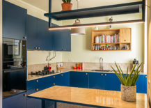 L-shaped-modern-kitchen-with-smart-space-savvy-shelving-and-cabinets-in-blue-97813-217x155