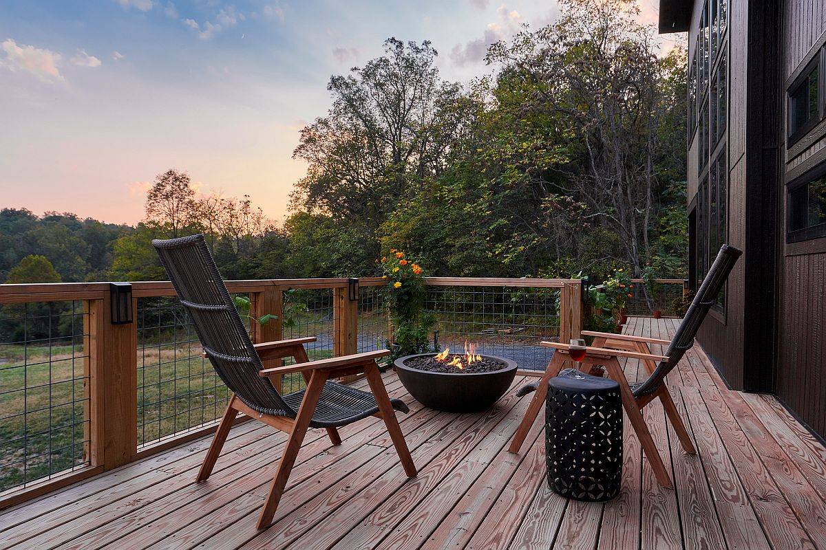 Lovely small rustic deck with a couple of chairs and a small fire pit