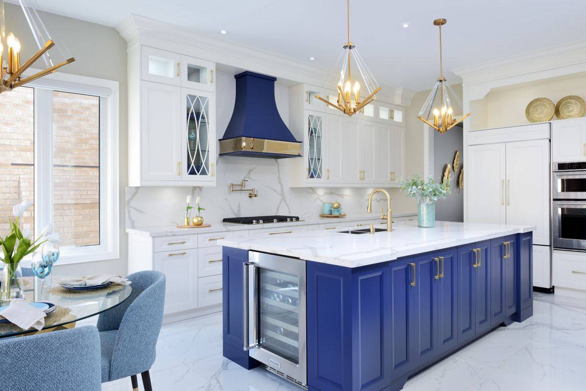 Marble brings polished modern charm to this lovely kitchen in blue and white