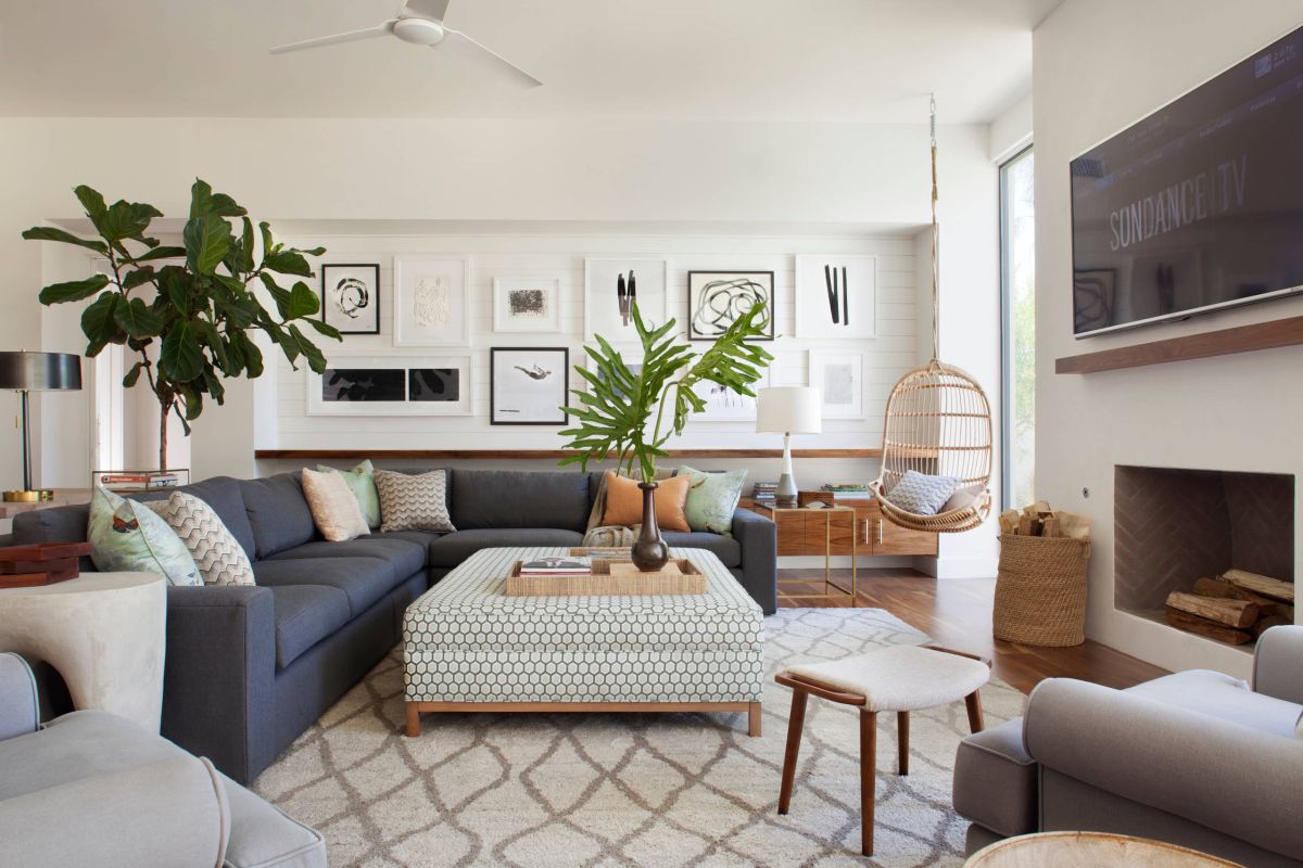 Midcentury modern living room in white with greenery adding color to the space