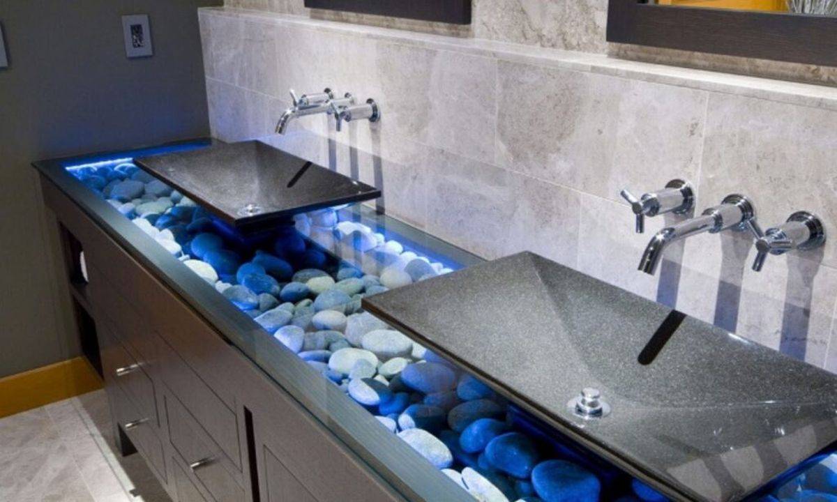 Natural river pebbles illuminated beautifully become a part of this gorgeous bathroom vanity