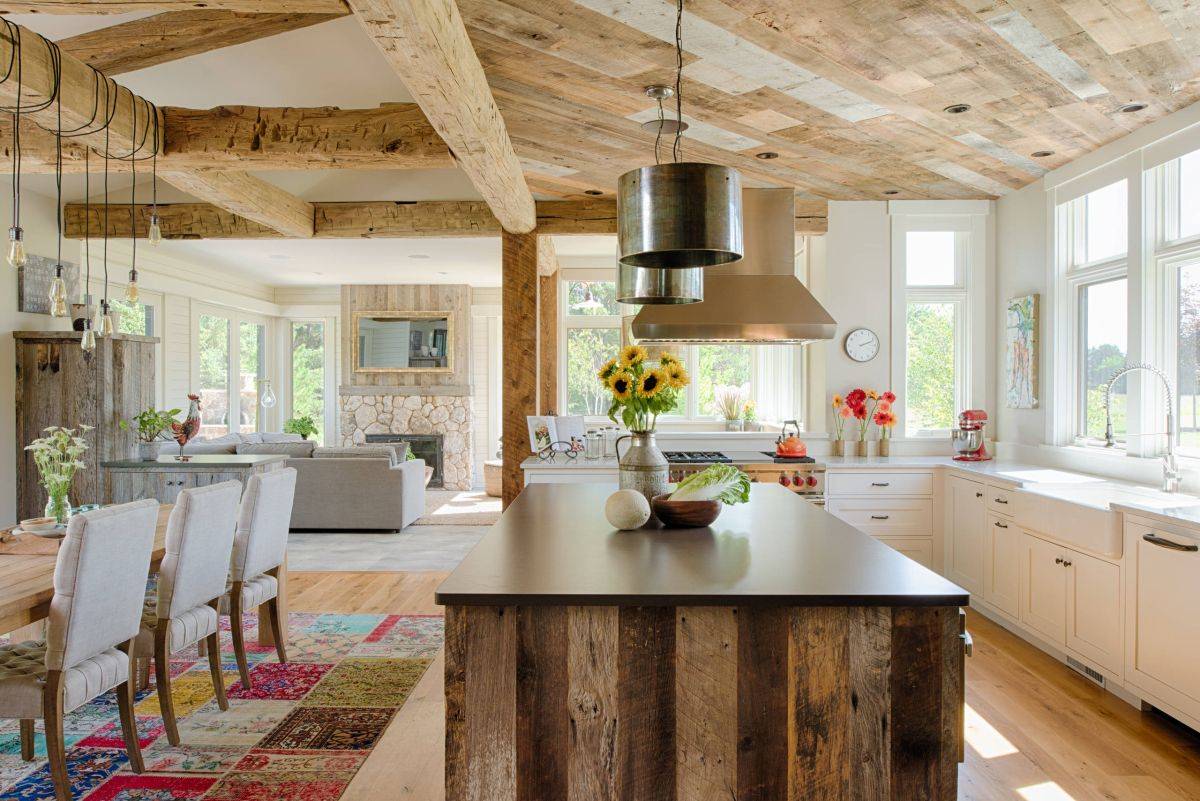 Pendants bring metallic sparkle to this farmhouse kitchen in wood