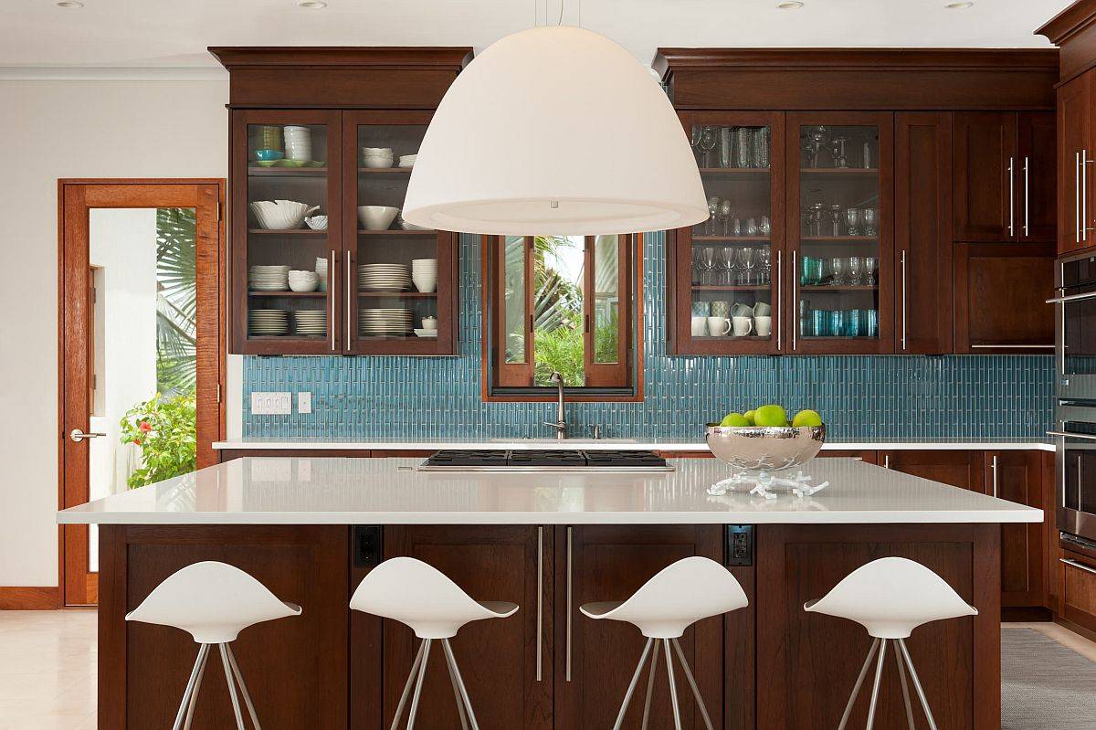 Slim blue tiles create a beautiful backdrop in this urbane kitchen