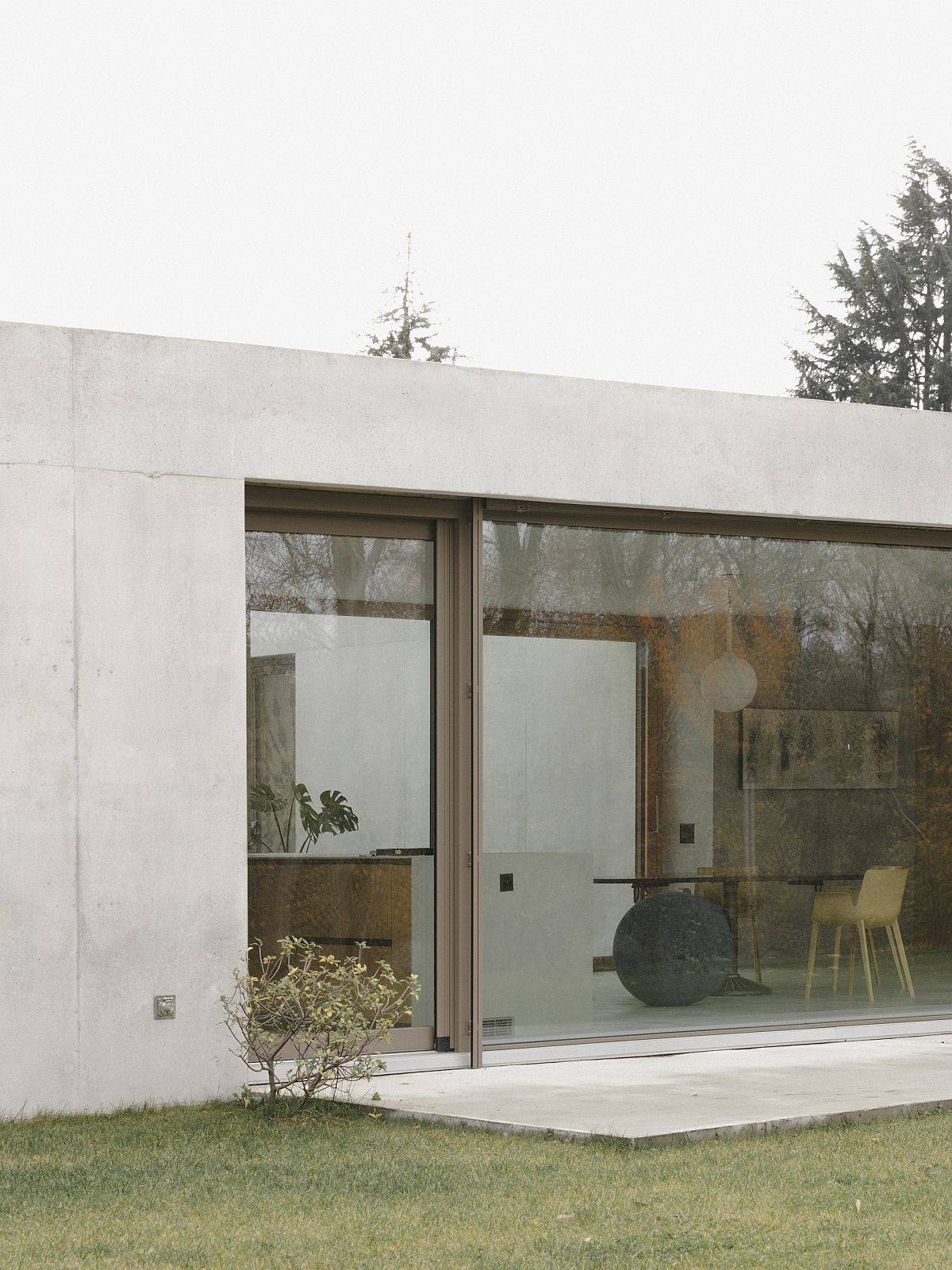 Small concrete deck on th outside extends private spaces