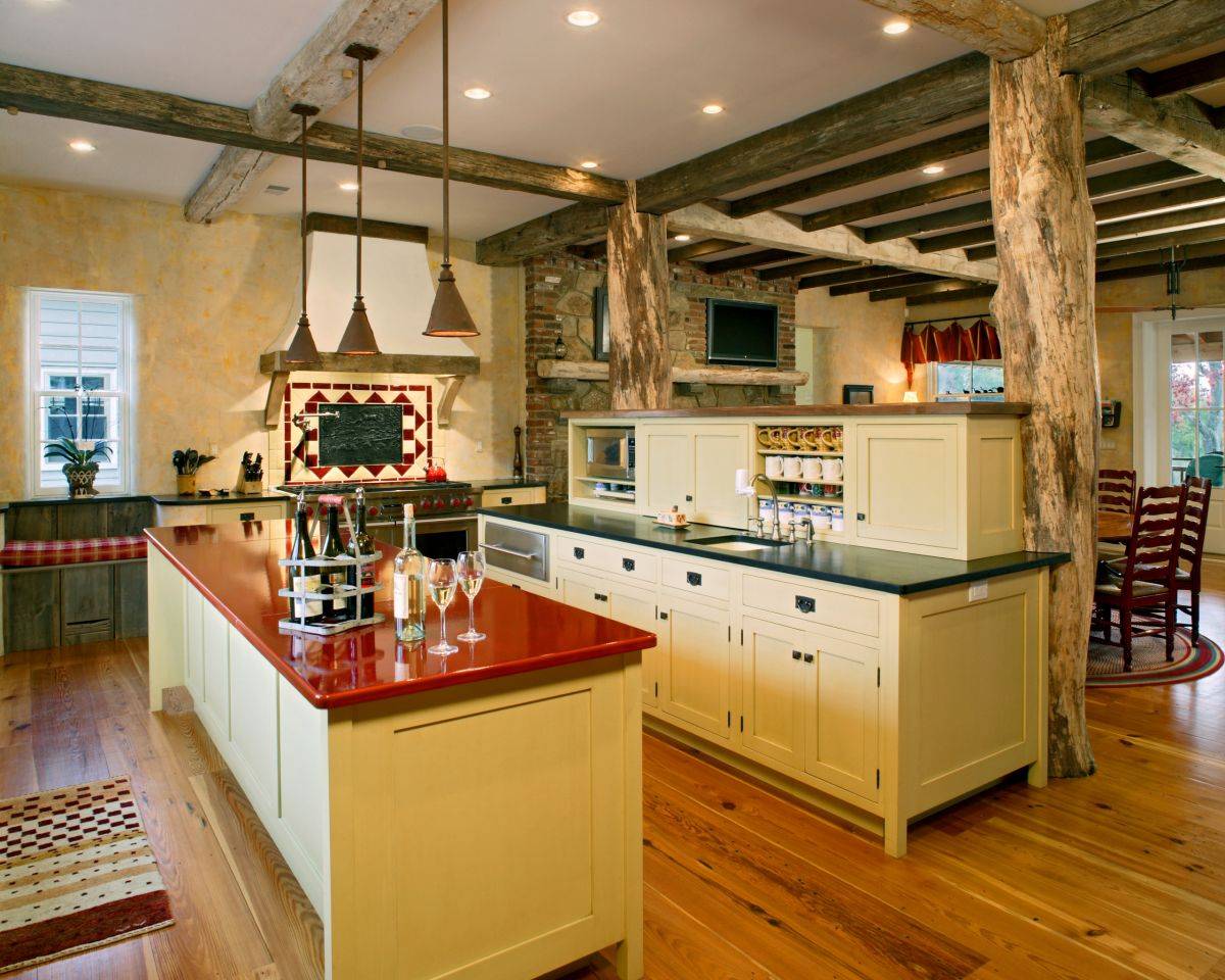 Textured yellow walls coupled with red and green countertops in the kitchen